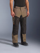 Alpinestars Cusco Drystar® Pants, Adventure Motorcycle Pants, Walnut Black, shown on a model with black boots, featuring a brown and black multi-panel design with zippered pockets and reinforced knees for touring