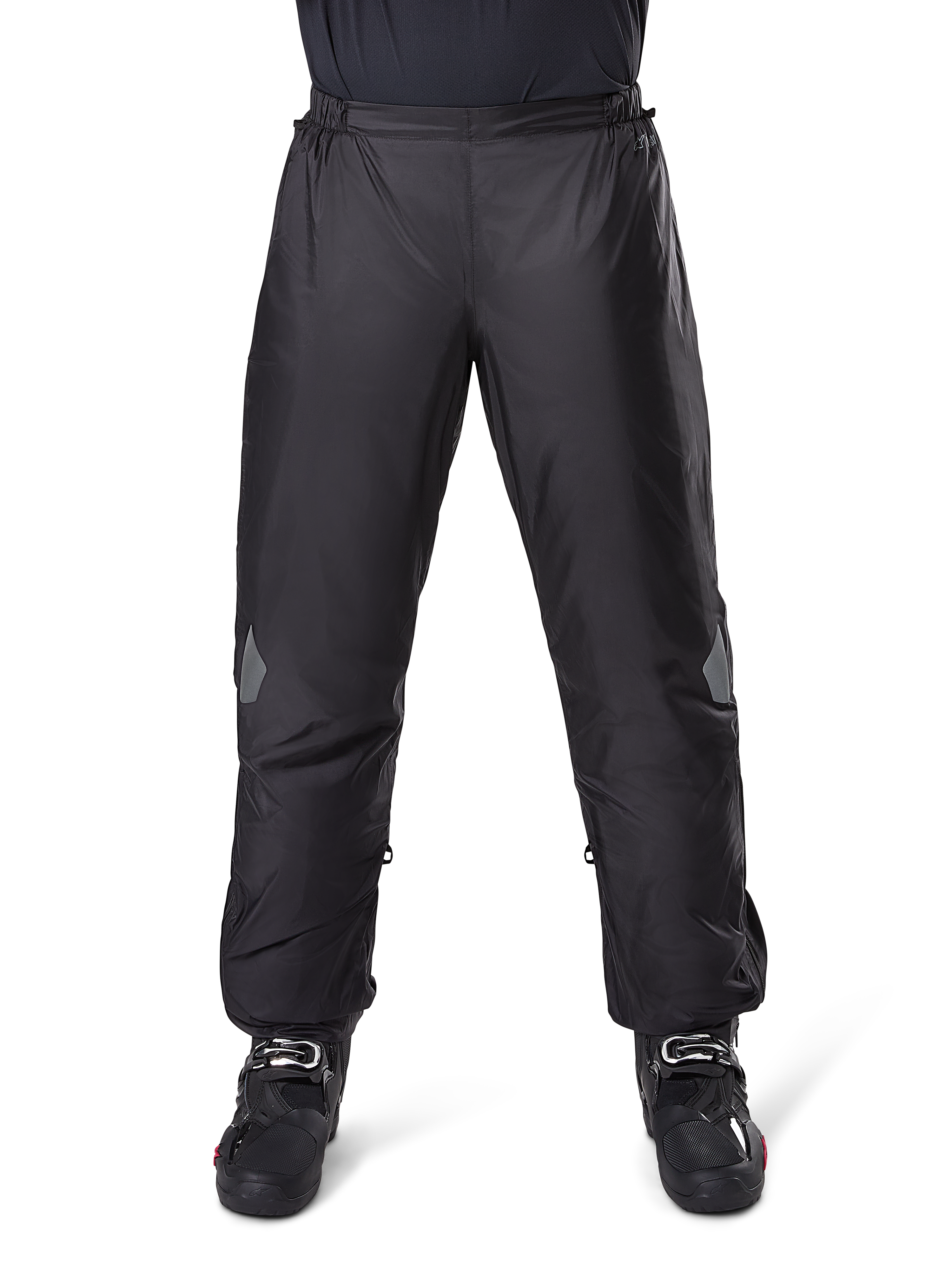 Alpinestars Bogota Pro Drystar 3 Seasons Pants, Waterproof Motorcycle Pants, Black, lightweight technical fabric with reflective knee patches, worn as over-pants with black riding boots, designed for adventure touring weather protection