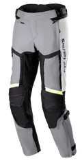 Alpinestars Bogota Pro Drystar 4 Seasons Pants, Regular fit motorcycle touring pants, Ice Gray and Dark Gray with Yellow Fluo reflective strips, featuring large thigh ventilation panels, accordion stretch on knees, and adjustable waist straps, adventure riding gear
