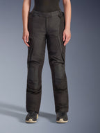 Alpinestars Stella Andes V4 Drystar Pants, Women's Adventure Touring Pants, Black, front view, featuring reinforced knee panels, water-resistant cargo pockets, and adjustable waist straps, worn with black boots in a studio setting.