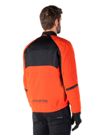 Rear view of a rider wearing the Alpinestars Mootant Waterproof Parka in Spicy Orange and Black, featuring a black mesh upper back panel and reflective MO.ST.EQ. branding, modern utilitarian motorcycle jacket.