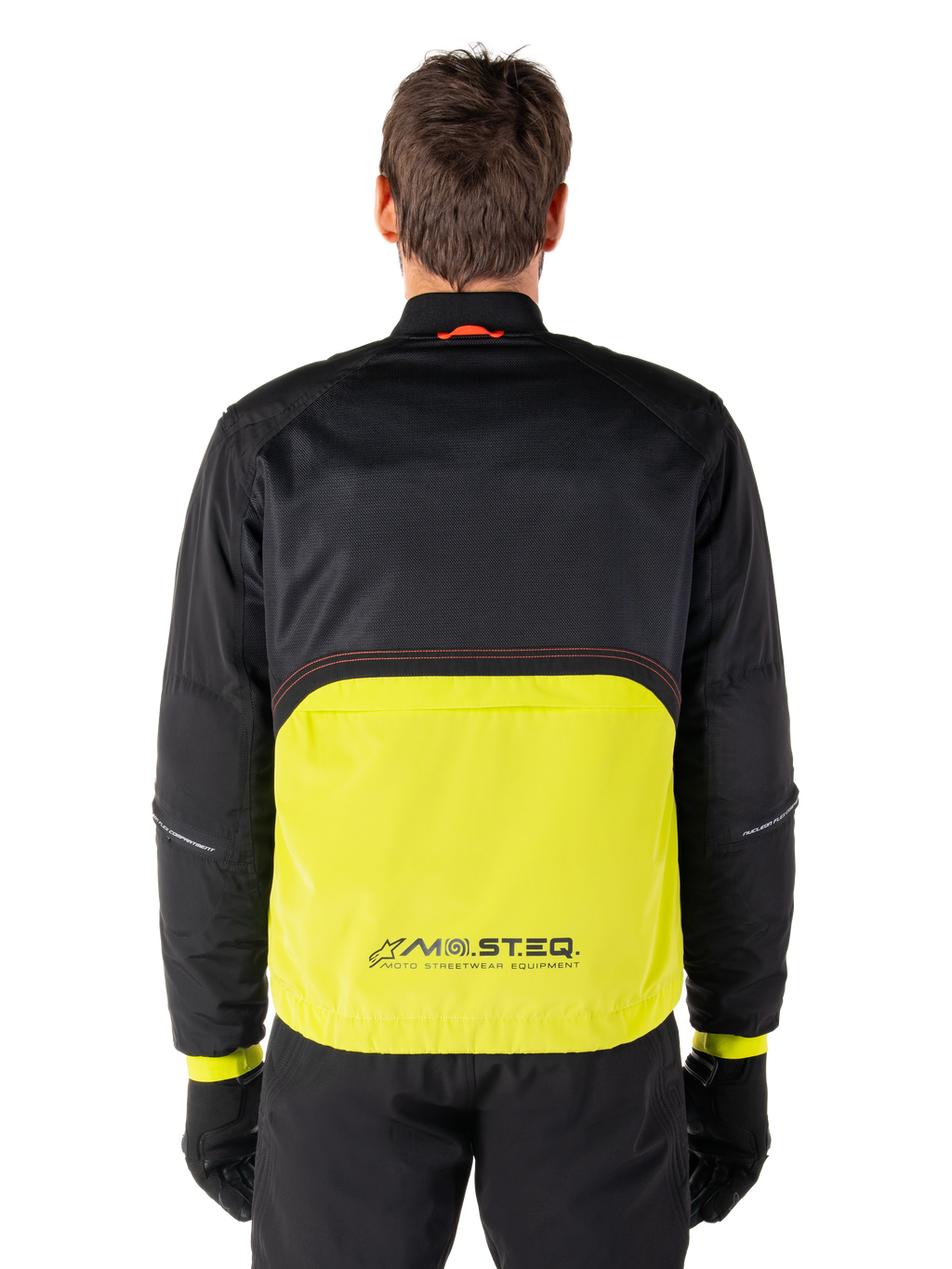 Alpinestars Mootant Waterproof Parka, Motorcycle Jacket, Lime Punch and Black, back view featuring black mesh upper for ventilation and lime lower section with MO.ST.EQ. logo, worn with black pants and gloves