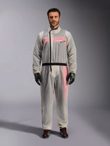 Alpinestars Kart Rain Suit, Clear, transparent waterproof oversuit worn by a model, featuring a black asymmetric zipper and chest logo, red and white racing suit visible underneath, paired with black and neon green gloves and black racing boots.