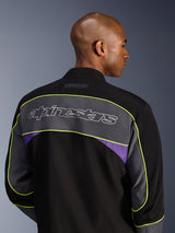 Alpinestars Unite Jacket, Urban Motorcycle Jacket, Black Asphalt Violet, back view showing a large grey shoulder panel with Alpinestars logo, neon yellow piping, and violet accents on a 3-layer softshell construction