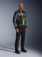 Alpinestars Unite Jacket, urban motorcycle jacket, Black Asphalt Violet with neon yellow accents, worn by model with black pants and sneakers, contemporary streetwear style for urban riding