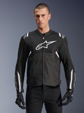 Alpinestars T-SPS Air V2 Jacket, Textile Motorcycle Jacket, Black with White Accents, large white chest logo, perforated mesh design for ventilation, worn with black pants and gloves