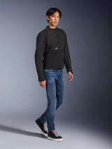 Alpinestars Provoke Jacket, Urban Motorcycle Jacket, Black, worn by a male model with blue jeans and black sneakers, technical textile design with small Alpinestars logo, full-body lifestyle shot for contemporary city riding