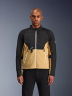 Alpinestars Provoke Jacket, Urban Motorcycle Jacket, Black and Camel, front view on a male model, featuring a two-tone design with white zippers, zippered chest pocket with D-ring, and small white Alpinestars logo, contemporary urban rider apparel.