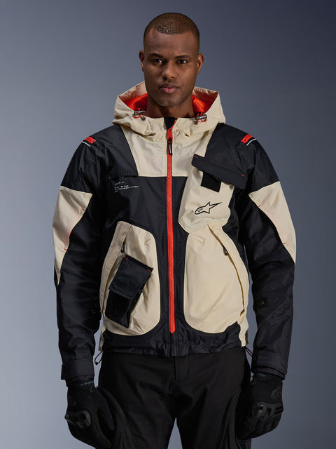 Alpinestars Mogress Air Jacket, urban road motorcycle jacket, Almond and Black with Hot Orange zippers and hood lining, hooded design with utility pockets, chest logo, worn with black gloves