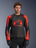 Alpinestars T-Stunt Air Jacket, Textile Motorcycle Jacket, Black Red Fluo and Dark Red, featuring large star logo and mesh panels for airflow, worn by model with black gloves