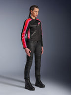 Alpinestars Stella T-Dyno Air Jacket, Women's Motorcycle Jacket, Black with Bright Red and Fuchsia stripes on sleeves, worn with black riding pants and boots, vintage-inspired mesh design for urban riding