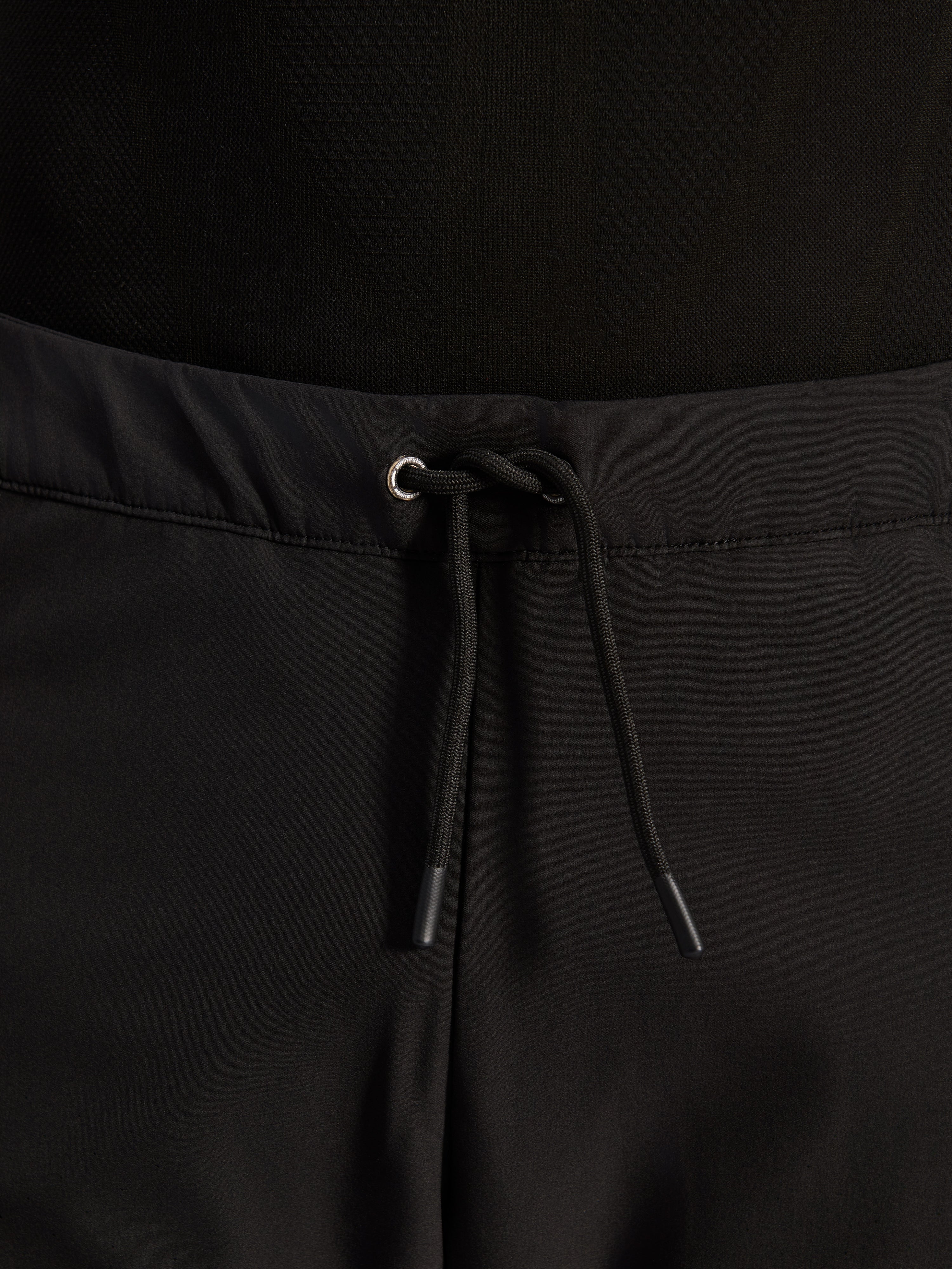 Alpinestars Aeroshell Airflow Pants, Black, close-up of waistband featuring adjustable internal elastic drawstring cord and silver eyelet detail, sport-touring motorcycle gear