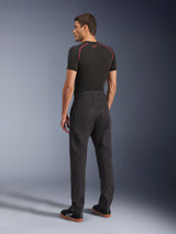 Alpinestars Flex-AST Canvas Pants, Black Urban Motorcycle Pants, rear view on model, paired with a black short-sleeve base layer and black sneakers, featuring workwear-inspired design with large back pockets and a modern straight-leg fit.