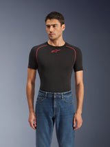 Alpinestars Flex-AST 5 Denim Pants in Indigo Washed, urban motorcycle jeans with a tapered fit, worn by a male model with a black short-sleeved base layer featuring red accents, casual road-to-street styling