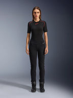 Alpinestars Womens Banshee Leggings, Black motorcycle leggings, figure-hugging anatomical fit, worn by a female model with a black base layer and motorcycle boots, featuring ribbed knee panels and high-waisted construction for urban riding.
