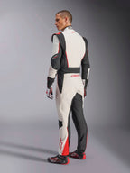 Alpinestars GP Tech V4 Suit, White Black Red racing suit, rear view showing ergonomic stretch panels on the lower back and legs, paired with matching racing gloves and shoes, professional motorsport apparel.