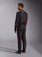 Alpinestars KMX-9 V3 Graphic 3 Suit, Black and Red, back view of model wearing full karting gear including black gloves and racing boots, featuring red side panels and white logo details