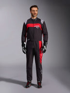Alpinestars KMX-9 V3 Graphic 3 Suit, Karting Suit, Black and Red, full-body front view worn by a model, featuring bold red graphic panels and white branding, paired with black racing gloves and shoes, professional motorsport apparel.