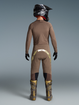 Alpinestars Limited Edition Supertech Air Gold Gear Set, perforated mesh jersey and gold-accented motocross pants, back view.