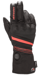 Alpinestars HT-5 Heat Tech Drystar® Gloves, Heated Motorcycle Gloves, Black with Red accents, featuring a circular power button on the cuff, red stripes across the hand and wrist, Alpinestars branding on the finger, designed for waterproof cold weather protection
