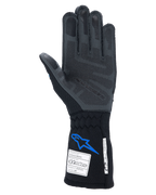 Alpinestars Tech-1 ZX V4 Gloves, Auto Racing Gloves, Black and Blue, palm view showing grey 3D silicone grip technology, featuring FIA and SFI certification tags on the cuff, professional motorsport protection