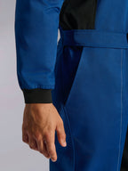 Alpinestars Kart Indoor V2 Suit, Blue karting suit, close-up detail of the adjustable waist belt and knitted wrist cuff, durable poly-cotton twill fabric with black accents and functional pocket