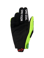 Alpinestars 2026 Radar Pro Gloves, palm view of a motocross glove, black synthetic suede with 'ONE GOAL' and 'ONE VISION' white text on fingers, bright fluo yellow mesh side panel, red Alpinestars logo on the wrist, minimalist performance gear for off-road riding