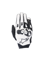 Alpinestars SP X 7 road racing gloves in white and black perforated leather with double-density TPU knuckles.
