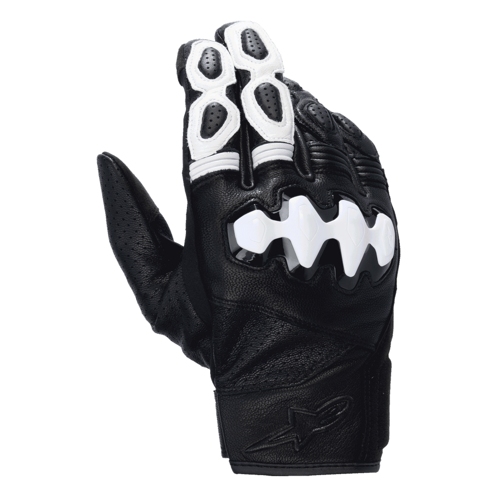 Alpinestars Celer V3 Gloves, Short Cuff Motorcycle Gloves, Black and White, featuring a white segmented hard knuckle protector, perforated goat leather construction, and white accents on the fingers with an embossed logo on the wrist