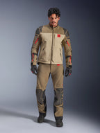 Alpinestars Nazca 3L GORE-TEX PRO Jacket, Walnut Rock Brown, adventure motorcycle riding jacket worn with matching pants and gloves, featuring red zipper accents, 'All Terra' chest logo, and rugged textile construction.