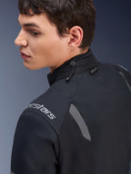 Alpinestars ST-7 2L GORE-TEX Jacket, Black and Dark Gray motorcycle jacket, close-up view of the collar showing the shock cord adjustment and Tech-Air label, featuring grey reflective accents and brand logo on the shoulder.