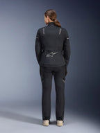 Alpinestars Women Stella ST-7 2L GORE-TEX Jacket, Black and Dark Gray, back view featuring the silver Alpinestars logo on the lower back, paired with matching black textile pants, adventure touring motorcycle gear