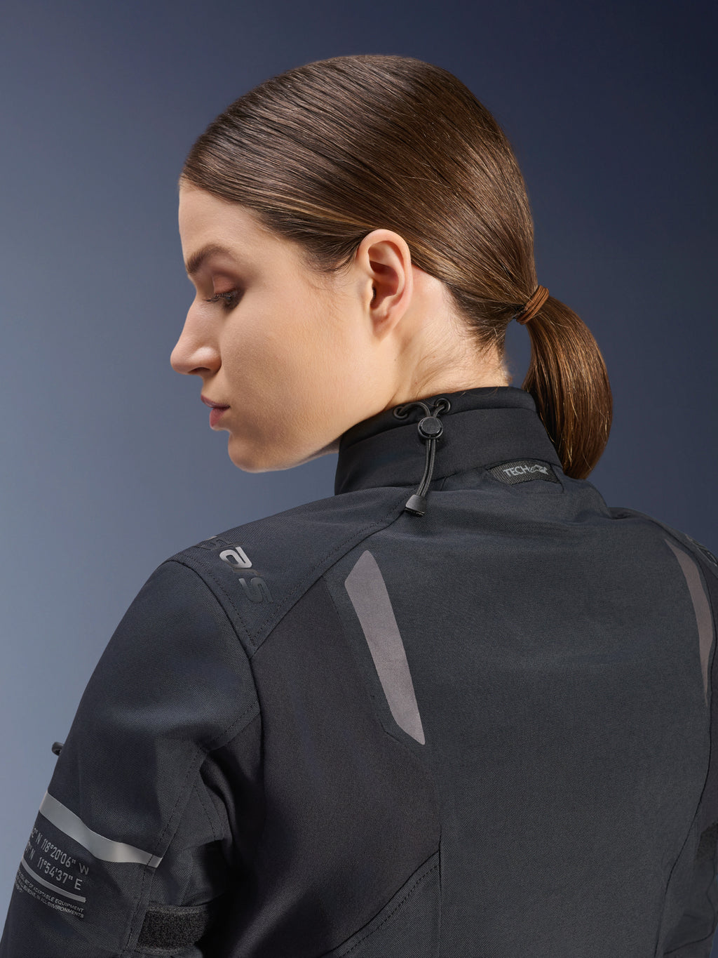Alpinestars Women Stella ST-7 2L GORE-TEX Jacket, Motorcycle Jacket, Black, side-back view showing adjustable neck closure with shock cord, reflective shoulder accents, and Tech-Air Ready branding, functional design for adventure touring