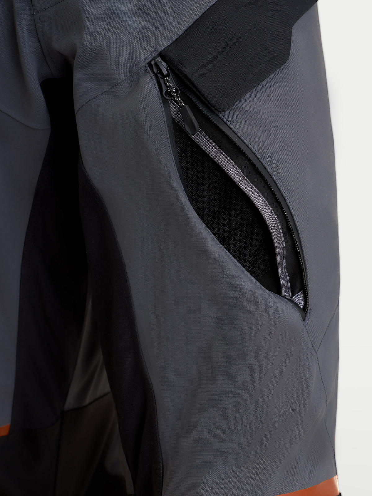 Alpinestars St-7 V2 2L Gore-Tex Pants, men's adventure touring motorcycle pants in deep gray and black, close-up view highlighting the zippered thigh ventilation opening and waterproof textile construction