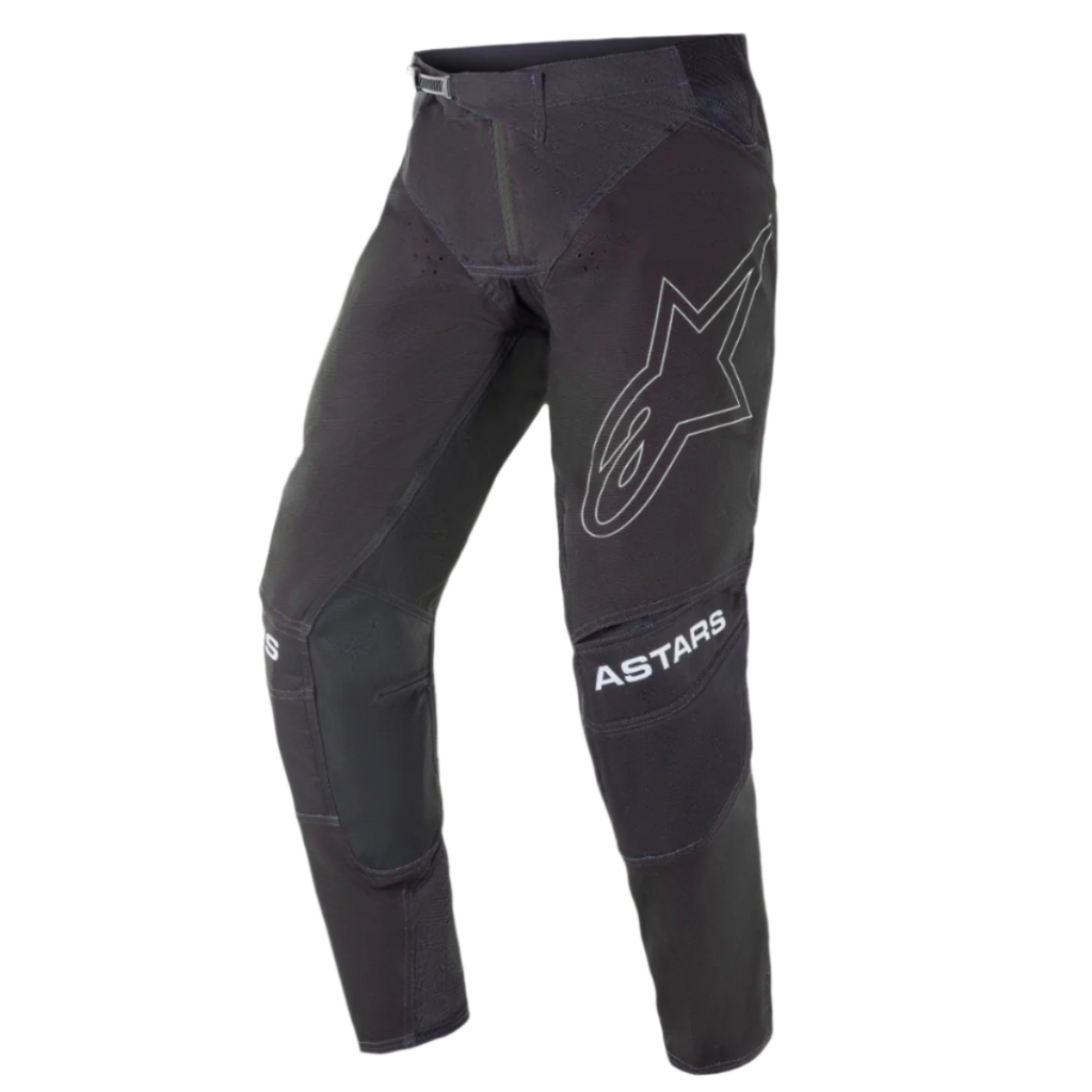 Alpinestars 2021 Techstar Phantom Pants, Motocross Pants, Black with White accents, featuring a large outlined star logo on the thigh, ASTARS branding on the knees, technical rip-stop fabric with perforated zones, and 3D Babel knee construction for off-road racing performance.