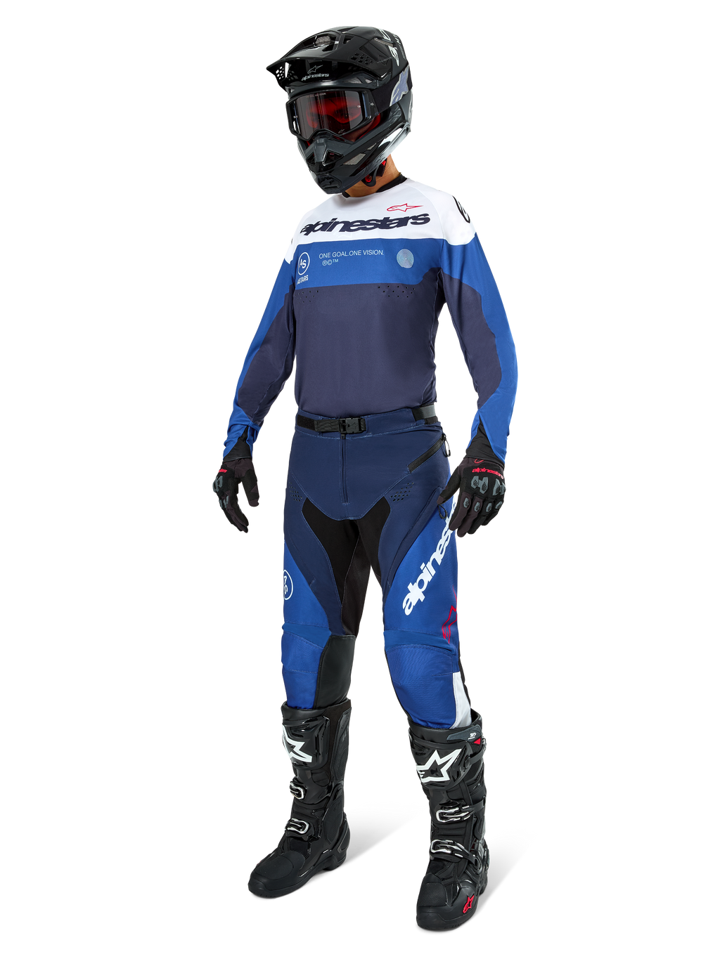 Motocross rider wearing Alpinestars Pro-Dura Pants in Navy, Bright Blue, and White, paired with a matching long-sleeve jersey, black helmet with red goggles, black gloves, and black and white boots, coordinated outfit for enduro and off-road racing.