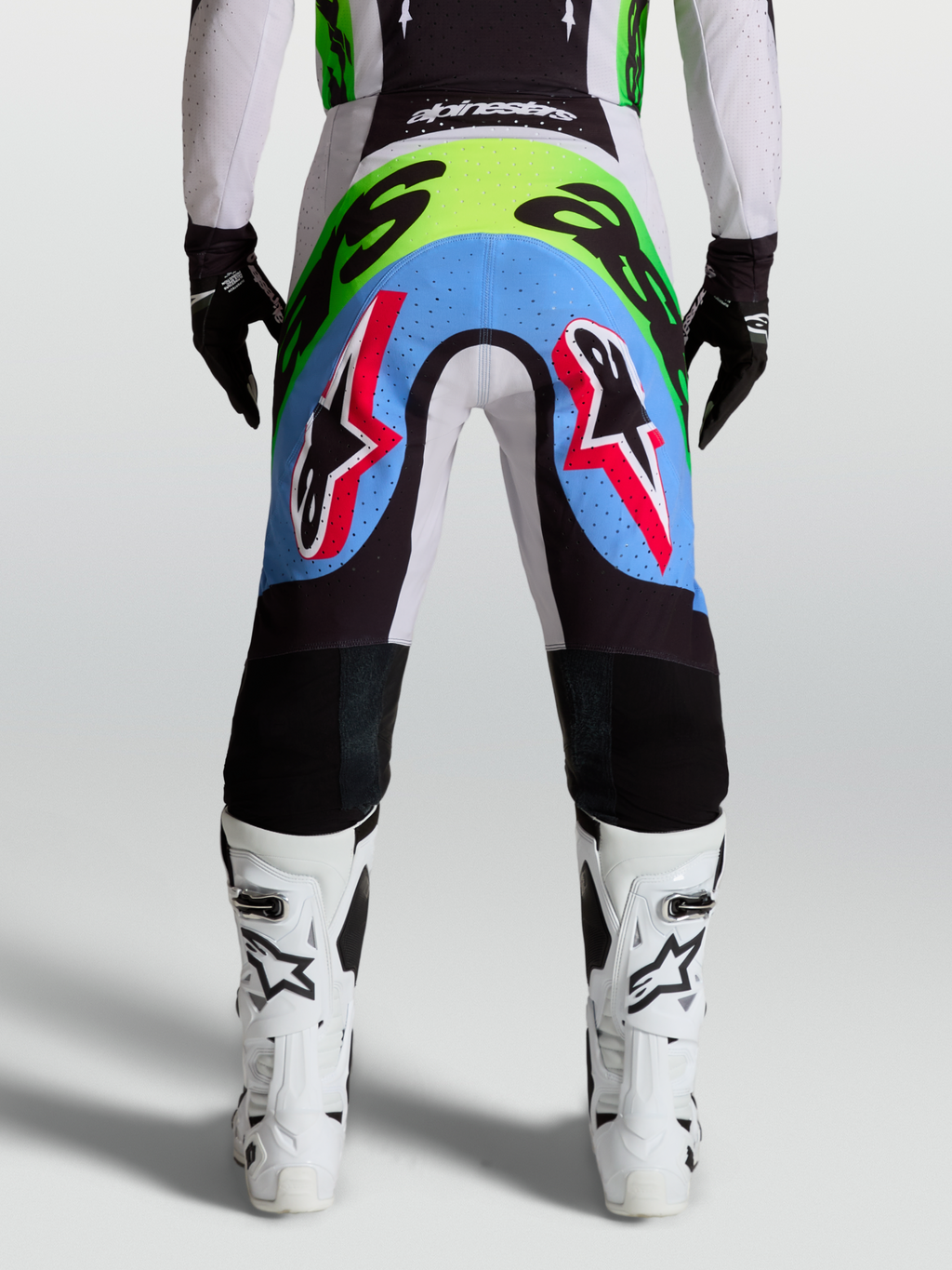 Alpinestars Supertech Dyna Men's Motocross Pants, rear view in light lilac and green fluo with perforated stretch panels.