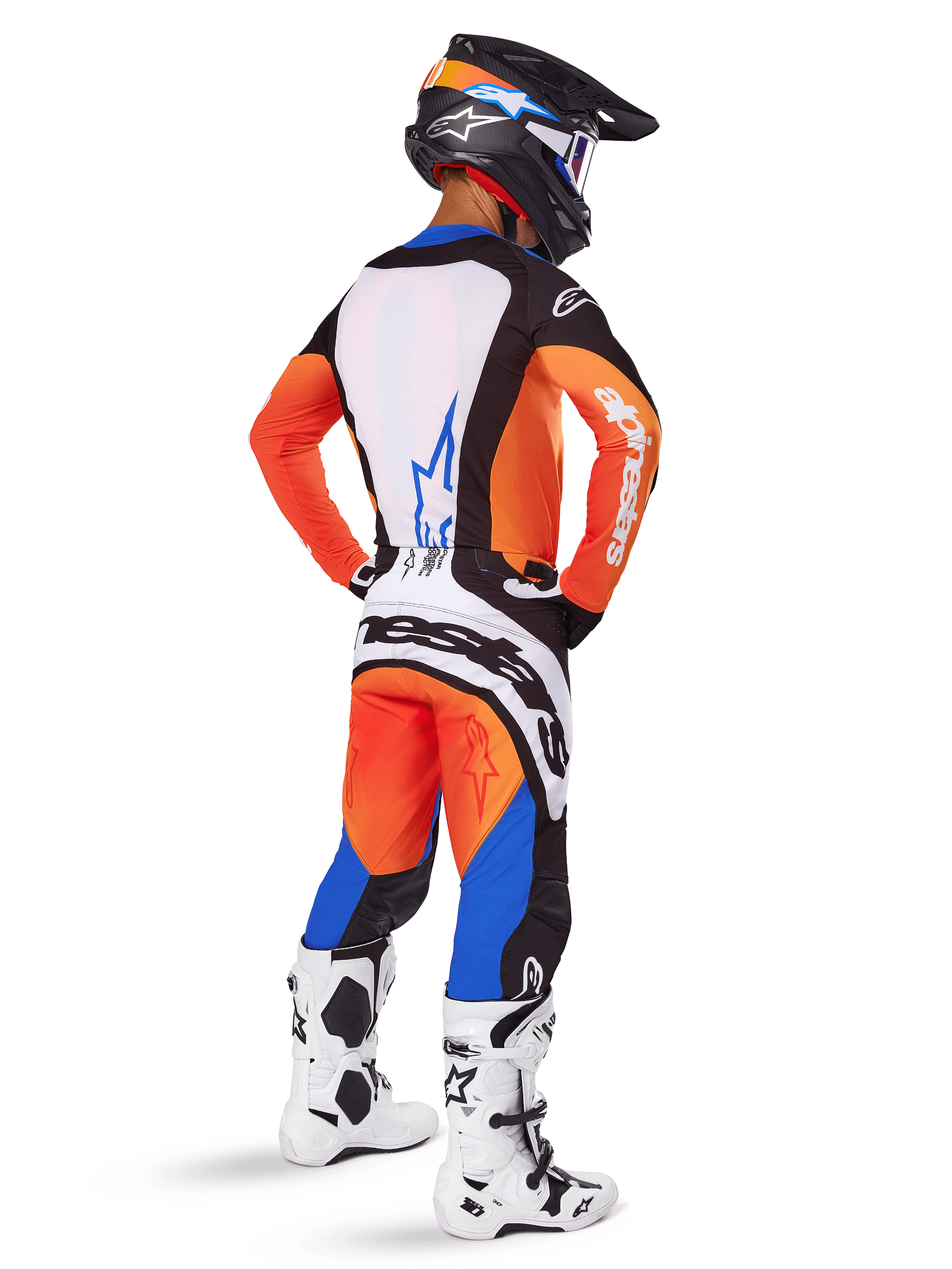 Motocross rider viewed from behind wearing the Alpinestars 2025 Techstar Melt Gear Set, Orange and Blue jersey with white back panel and matching pants, featuring large white branding, black motocross helmet, and white racing boots.