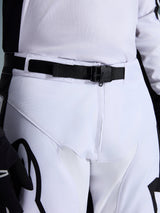 Alpinestars 2026 Racer Riway Pants, Motocross Pants, White and Black, close-up of the waist featuring the SX2 magnetic buckle and adjustable belt, durable polyfabric construction with black branding.