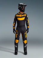Alpinestars 2026 Racer Riway Pants, Motocross Pants, Yellow and Black, worn as a complete racing kit with matching long-sleeve jersey, black helmet, black goggles, and black boots with white star logos, professional off-road riding gear