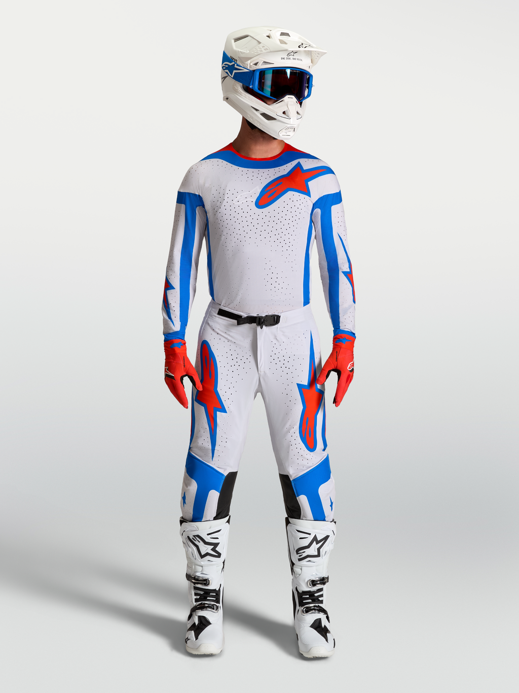 Alpinestars Supertech Vesta Motocross Gear Set in Light Lilac and Cardinal Red, featuring racing jersey, pants, and boots.