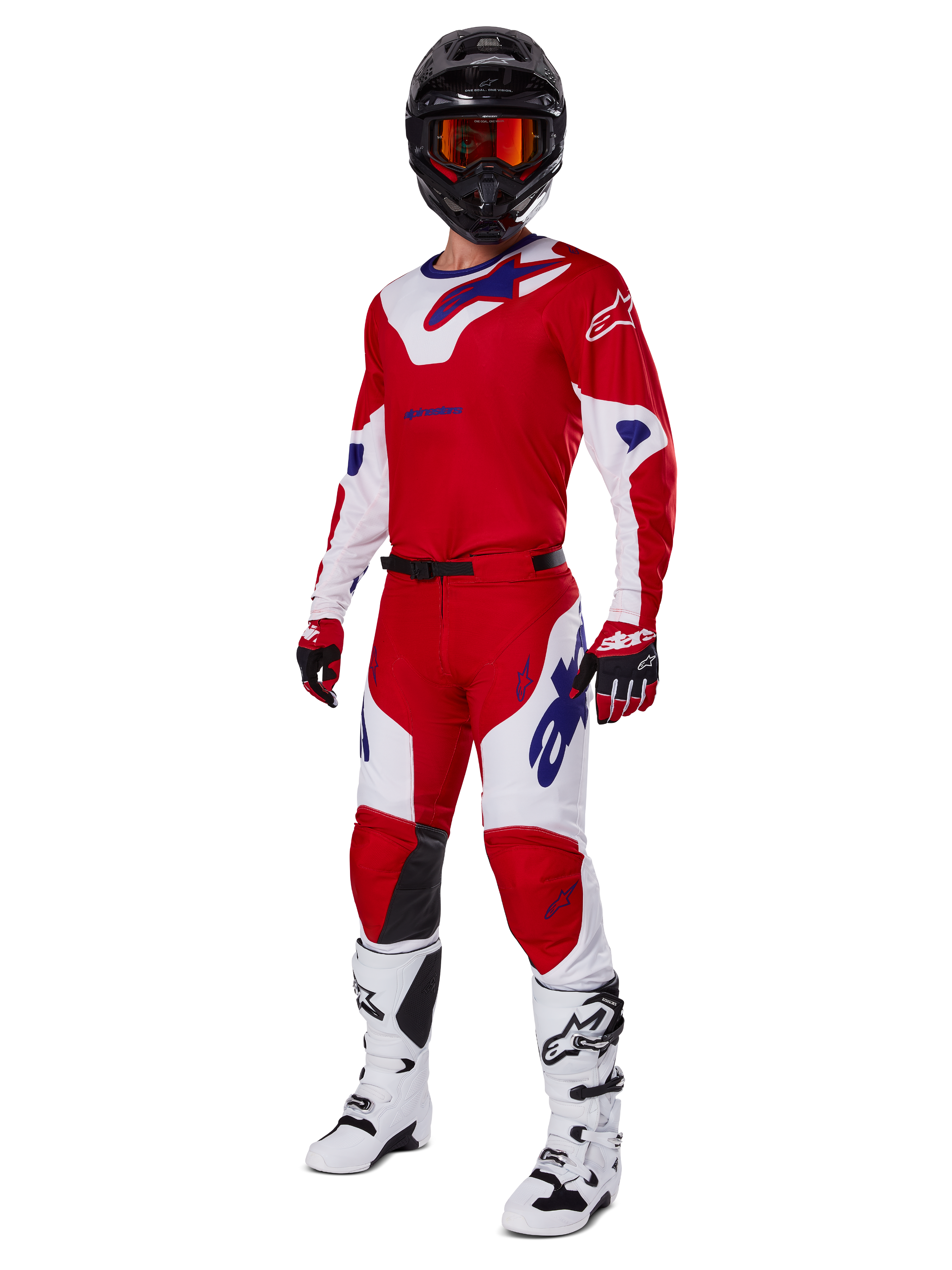 Alpinestars 2025 Racer Veil Pants, Motocross Pants, Bright Red and White, worn as part of a complete racing gear set including a matching red and white jersey, black helmet with orange goggles, white boots, and red gloves, featuring bold blue Alpinestars logos.