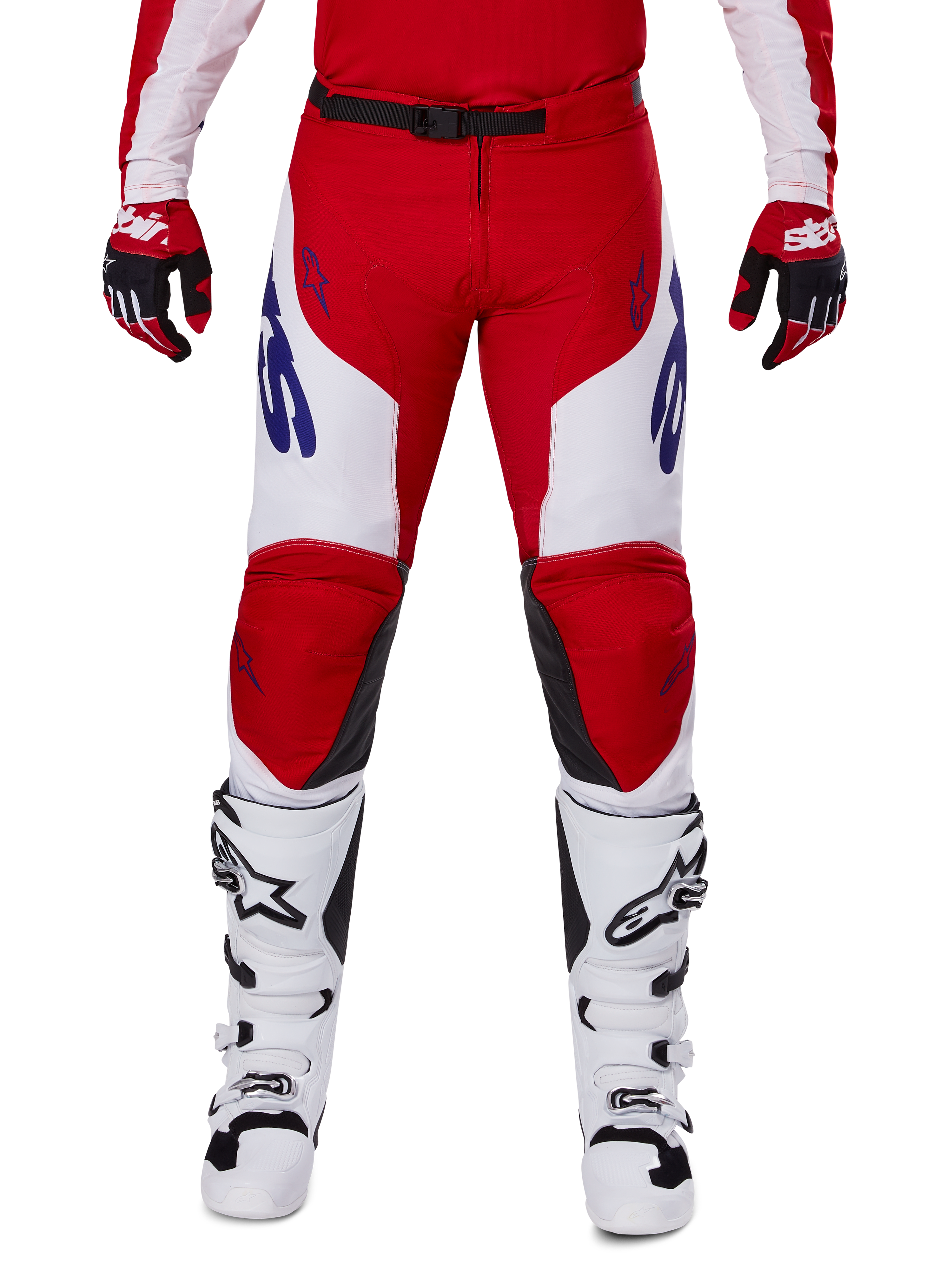 Alpinestars 2025 Racer Veil Pants, Motocross Pants, Bright Red and White, worn with matching red gloves and white boots, featuring blue branding on the thighs and a black waist belt, ergonomic sport cut for performance riding