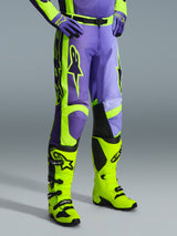 Alpinestars 2026 Racer Portl Pants, Motocross Pants in Purple and Yellow Fluo, worn by a rider with matching fluo yellow boots and purple gloves, featuring bold Alpinestars branding and ergonomic design for off-road performance