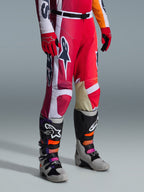Alpinestars 2026 Racer Portl Pants, Motocross Pants, Red Light Gray and Dark Gray, worn with matching red gloves and multi-colored motocross boots, featuring bold Alpinestars logos and reinforced panels for off-road racing.