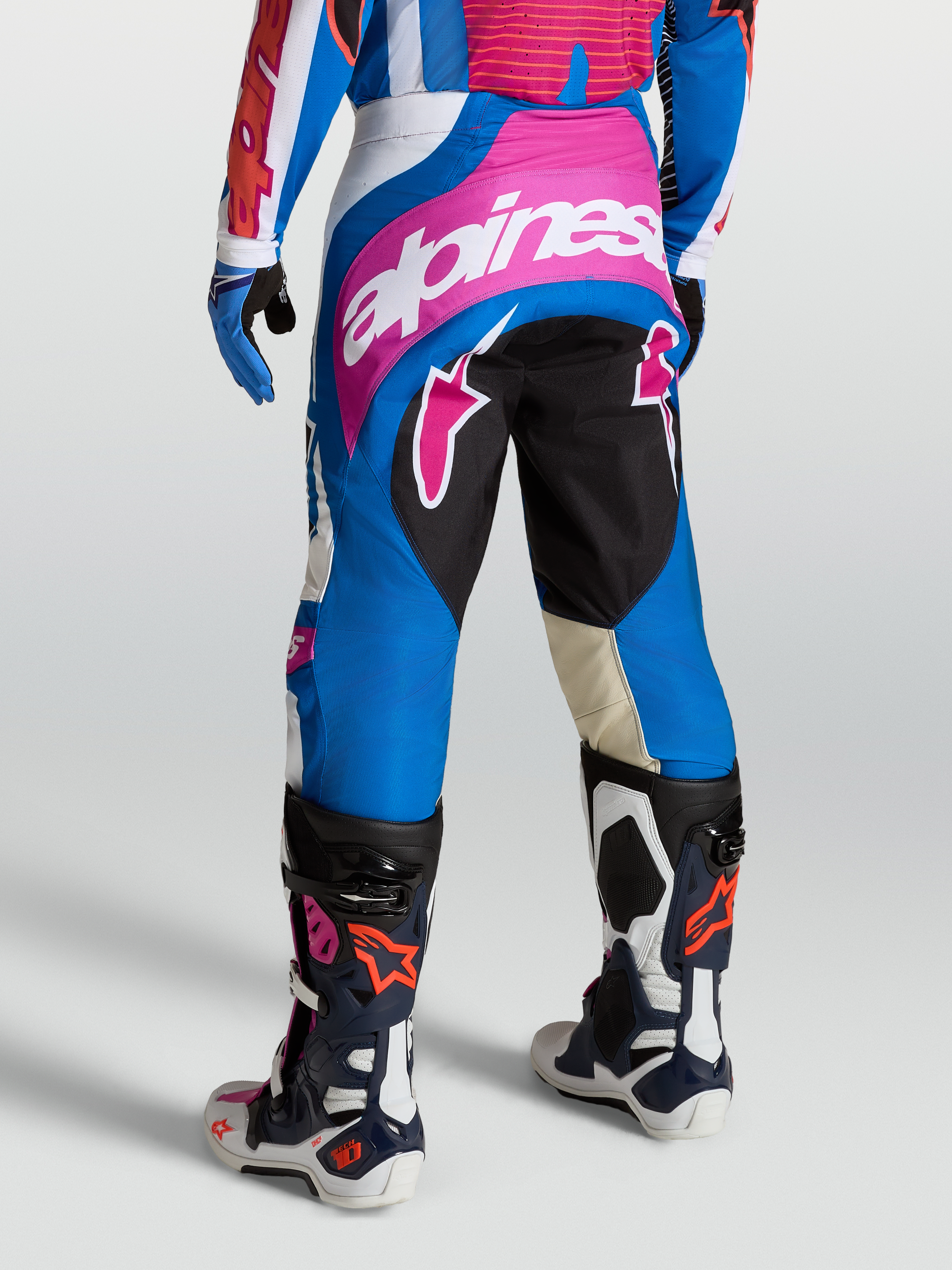 Alpinestars Techstar Maven Pants, Blue and Red motocross gear for men, featuring durable polyfabric, 4-way stretch panels, and a Babel knee gusset for racing performance.