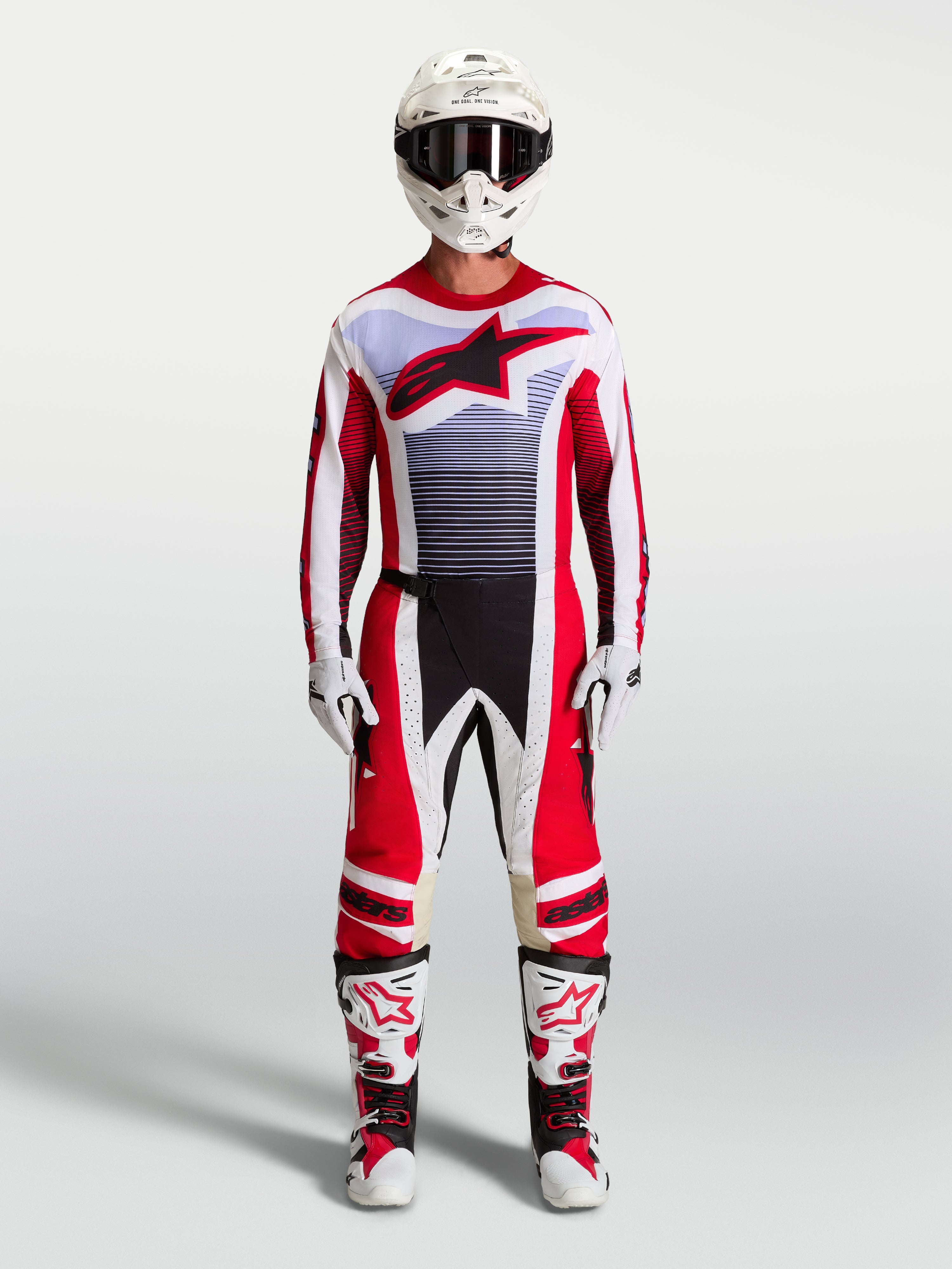 Alpinestars Techstar Maven Pants and motocross gear set in fire red and white with lavender accents and matching boots.