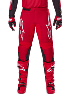 Alpinestars 2025 Fluid Haul Pants, Motocross Pants, Bright Red and Black, featuring large white logos on the thighs and black inner leg panels, worn with matching red boots and gloves, athletic fit for motocross performance