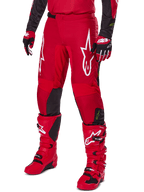 Alpinestars 2025 Fluid Haul Gear Set, Motocross outfit in Red and Black, featuring red pants with bold white Alpinestars logos, matching red technical boots, and red and black gloves, coordinated design for off-road performance