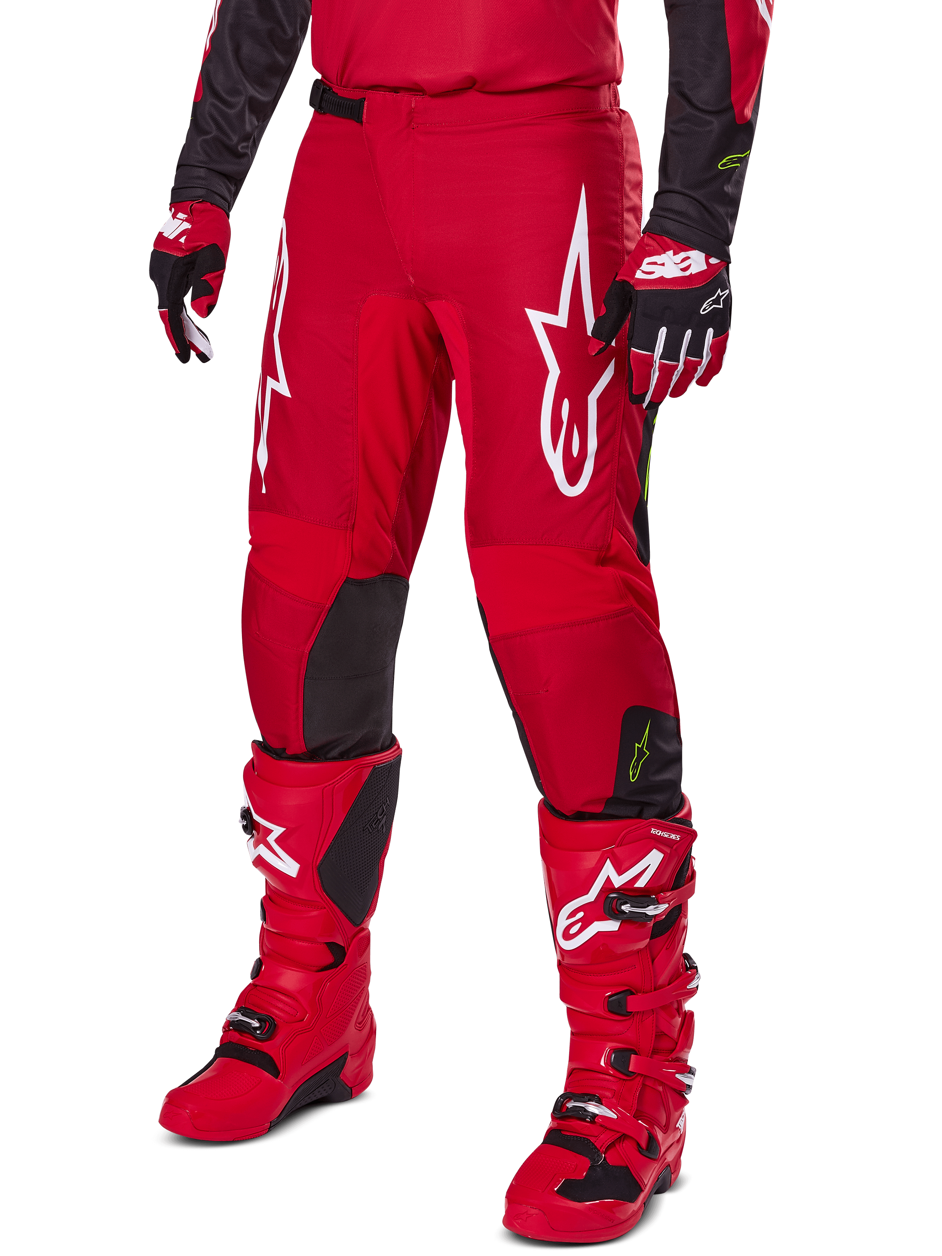 Alpinestars 2025 Fluid Haul Gear Set, Motocross outfit in Red and Black, featuring red pants with bold white Alpinestars logos, matching red technical boots, and red and black gloves, coordinated design for off-road performance